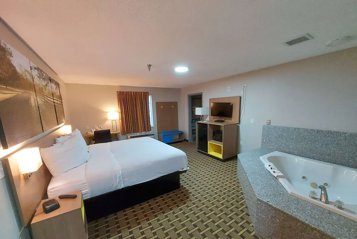 Image of Days Inn & Suites by Wyndham Huntsville with hot tub in room