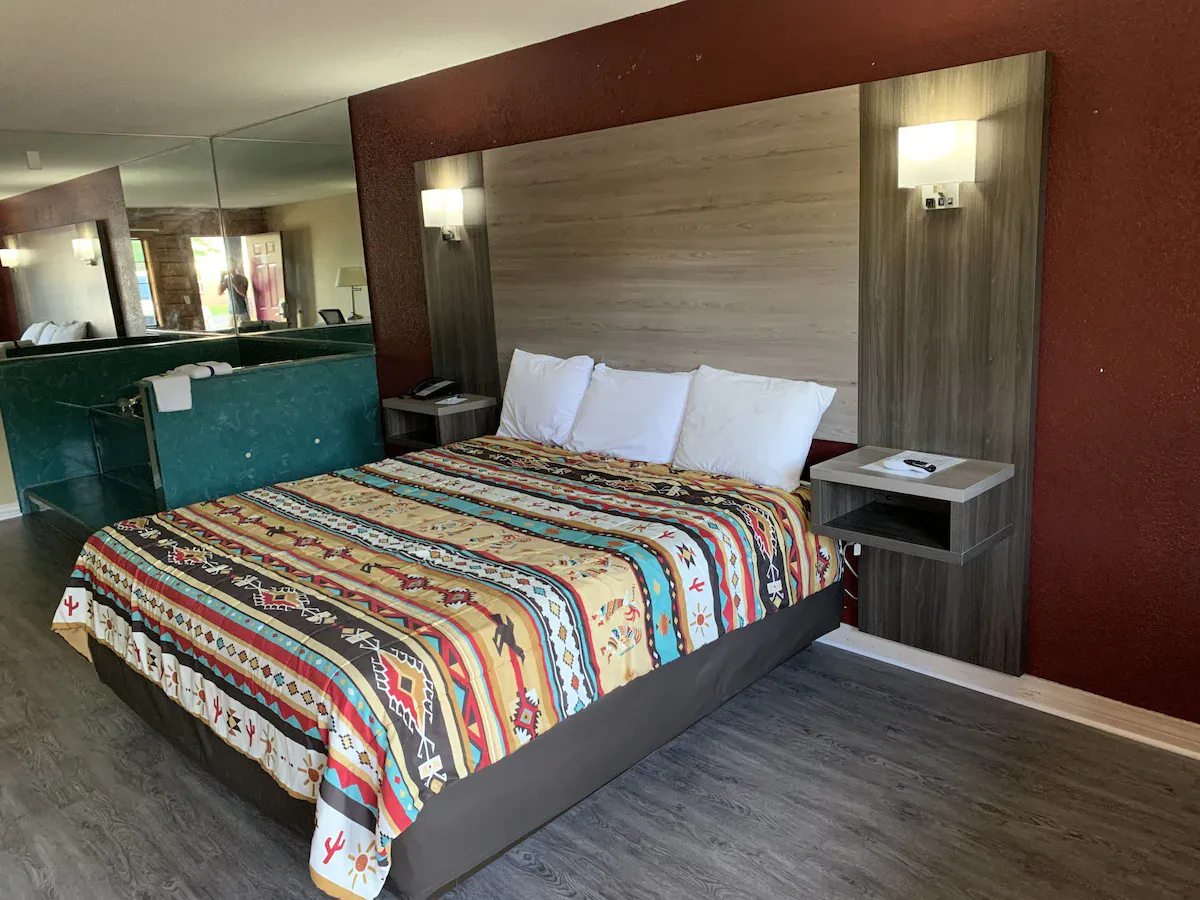Image of Log Cabin Inn with hot tub in room