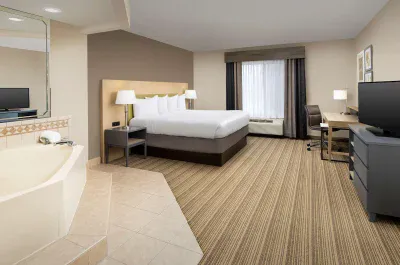 Image of Country Inn & Suites by Radisson, Gainesville, FL with hot tub in room