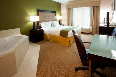 Image of Holiday Inn Express Hotel & Suites Jacksonville – Mayport Beach with hot tub in room