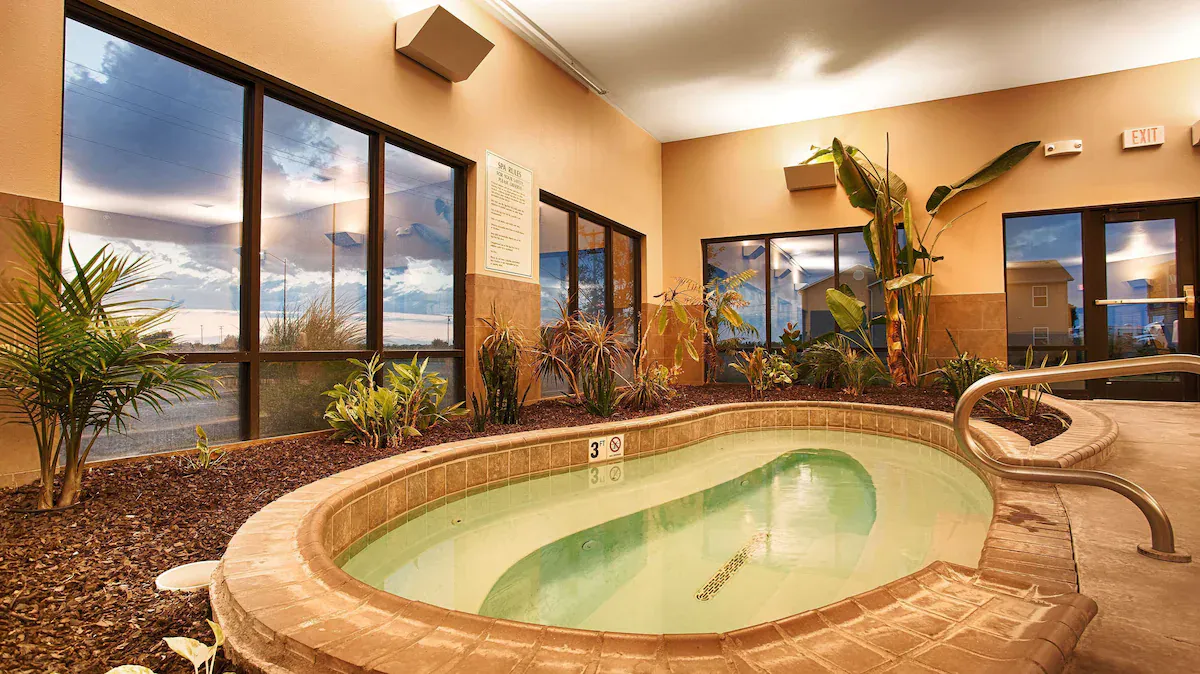 Image of Best Western Plus Night Watchman Inn & Suites with hot tub in room