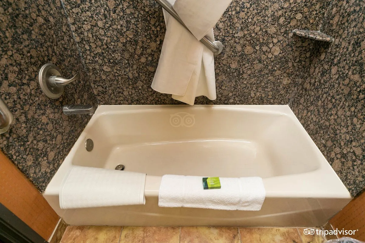 Image of Best Western Premier Kc Speedway Inn & Suites with hot tub in room