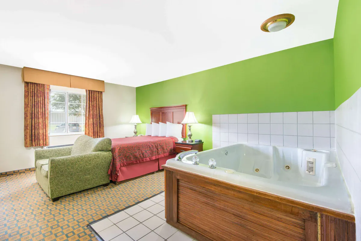 Image of Days Inn & Suites by Wyndham Wichita with hot tub in room