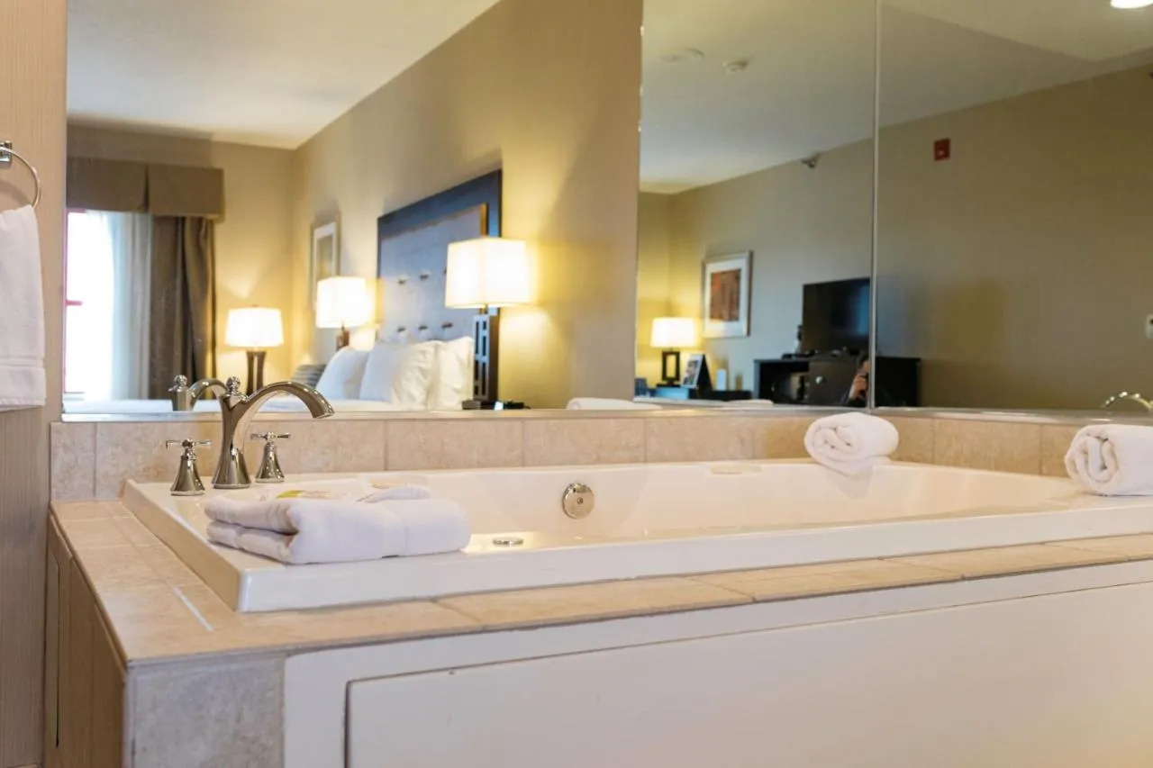 Image of Holiday Inn Express & Suites Olathe North, an IHG Hotel with hot tub in room