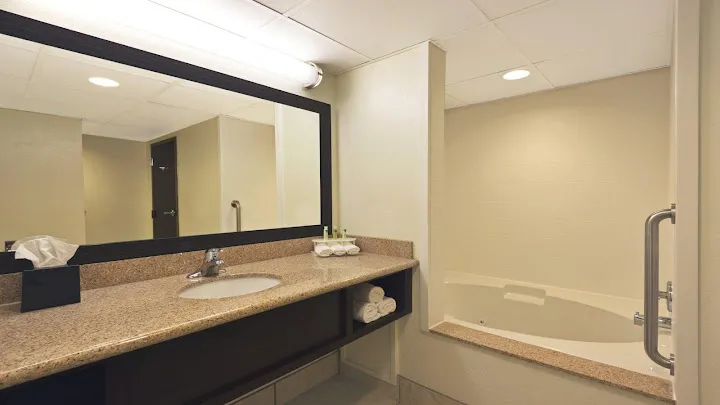 Image of Holiday Inn Express Hotel & Suites Colby, an IHG Hotel with hot tub in room