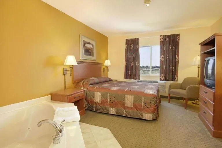 Image of Super 8 by Wyndham Topeka at Forbes Landing with hot tub in room