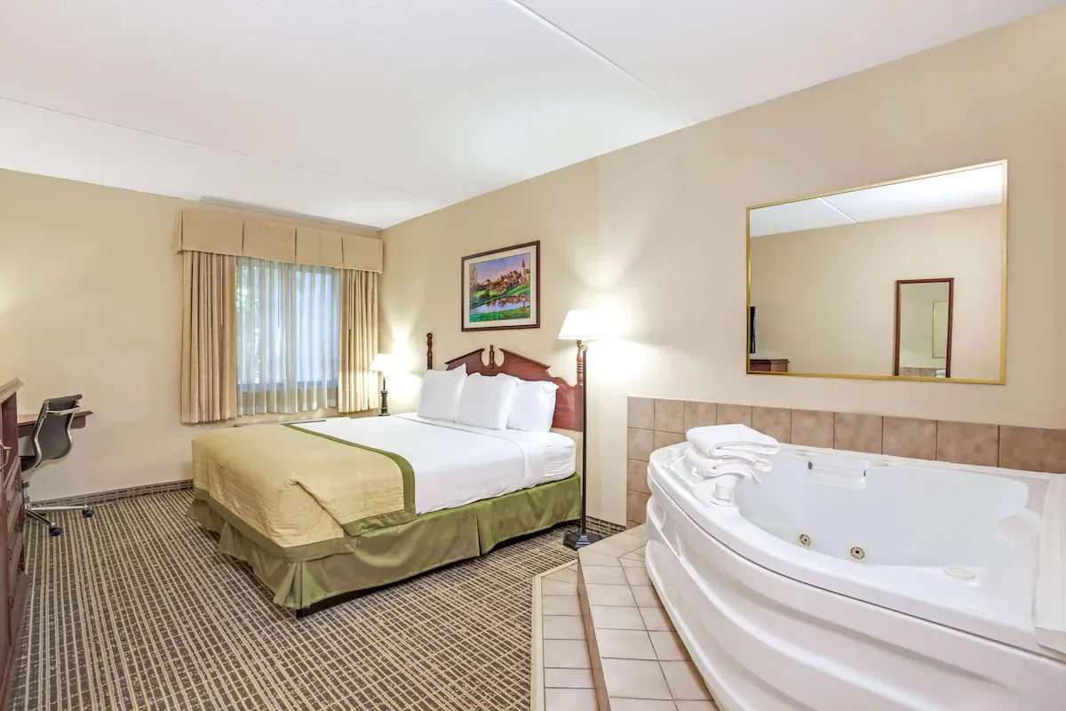 Image of Baymont by Wyndham Louisville Airport South with hot tub in room