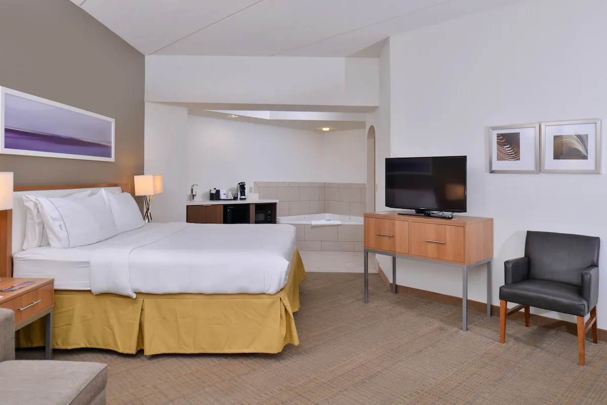 Image of Holiday Inn Express and Suites New Orleans Airport, an IHG Hotel with hot tub in room