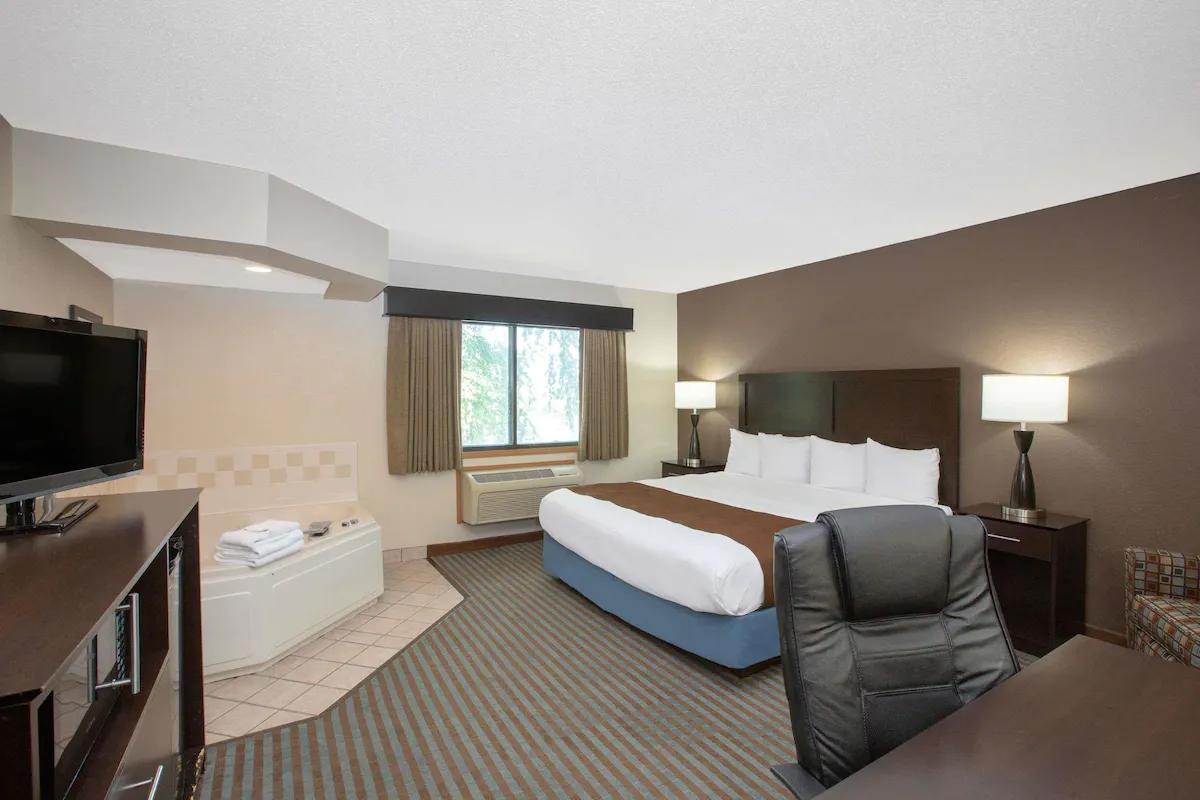 Image of AmericInn by Wyndham Lincoln North with hot tub in room