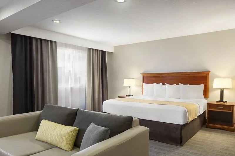 Image of Country Inn & Suites by Radisson, Sidney, NE with hot tub in room