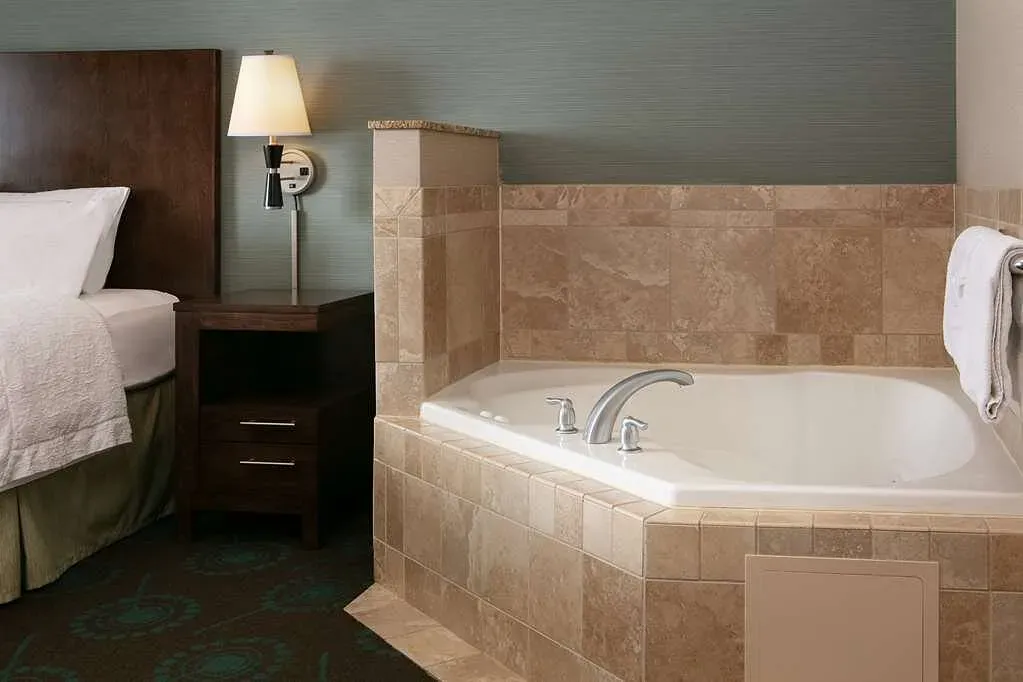 Image of Hampton Inn & Suites Lincoln – Northeast I-80 with hot tub in room