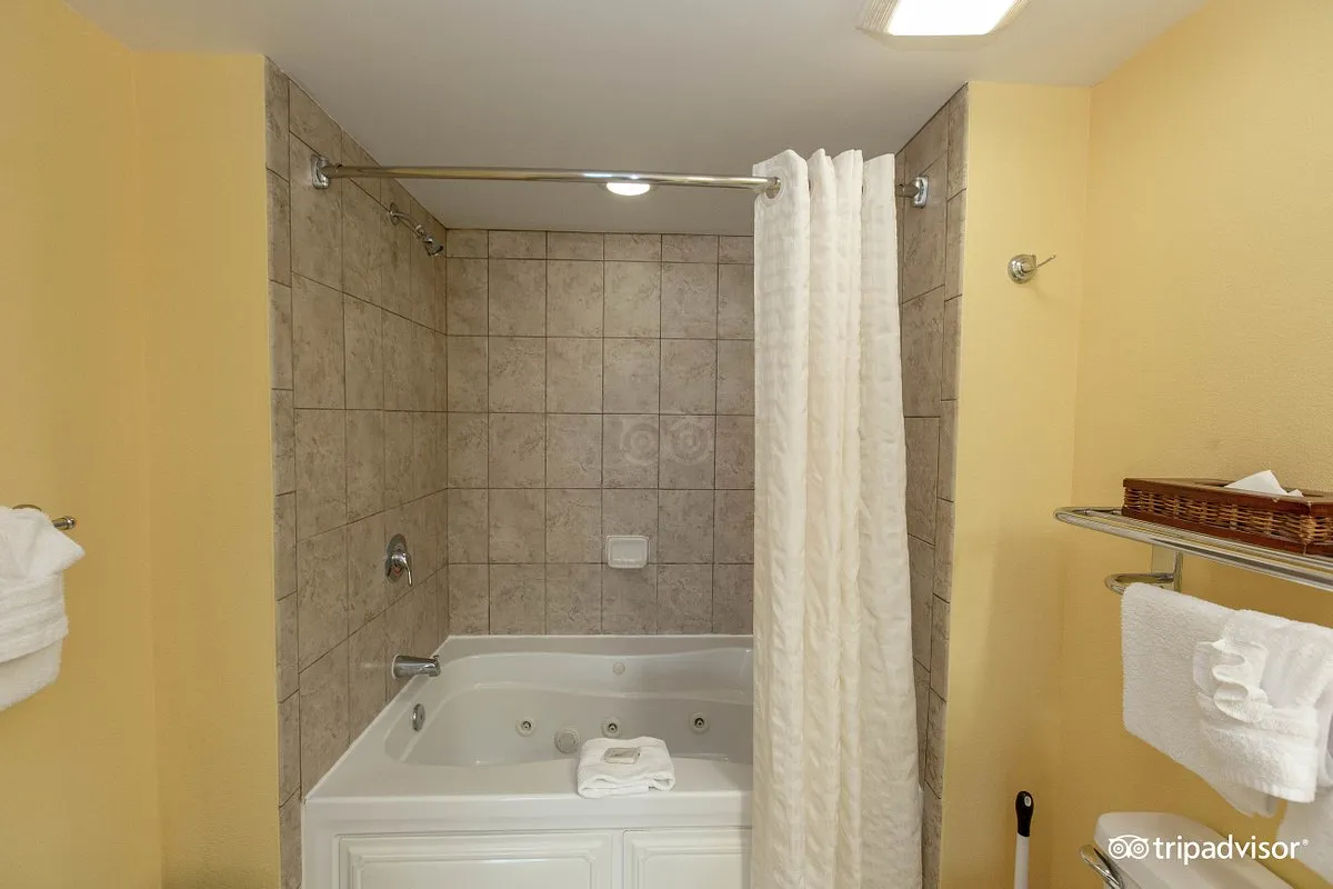 Image of Dunes Village Resort with hot tub in room