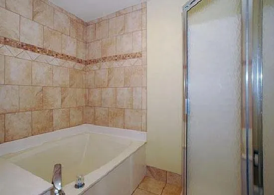 Image of Quality Inn & Suites with hot tub in room