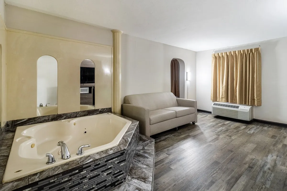 Image of Red Roof Inn & Suites Jackson, TN with hot tub in room