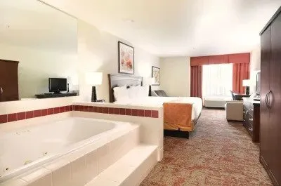 Image of Crystal Inn Hotel & Suites with hot tub in room