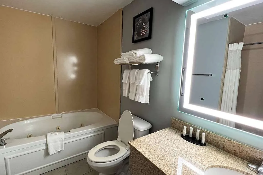 Image of AmericInn by Wyndham Marshfield with hot tub in room