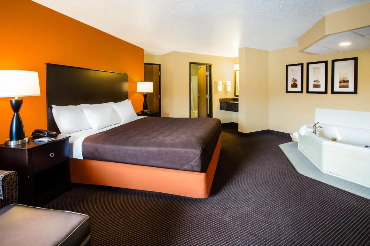 Image of AmericInn by Wyndham Menomonie with hot tub in room