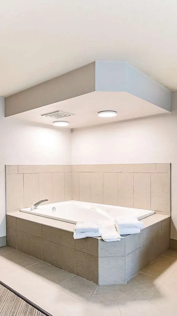 Image of Country Inn & Suites by Radisson, Appleton, WI with hot tub in room